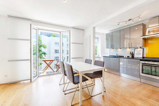 Living/dining area with south-facing balcony