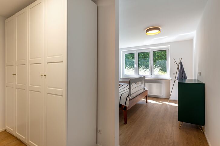 Bright bedroom with a walk-in closet
