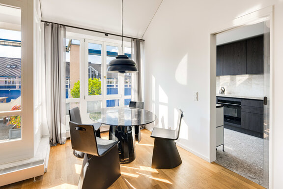 Dining area with adjoining kitchen