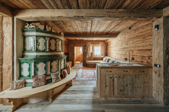 Living area with a charming tiled stove