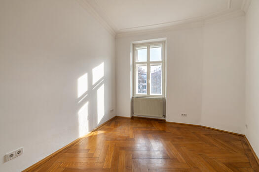 The bright bedroom is complemented by a walk-in closet