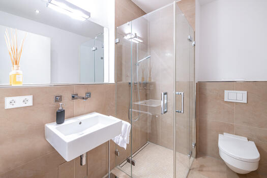 Shower bathroom designed analogously to the master bathroom