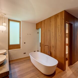 Adjacent master bathroom with a sauna that gets natural light