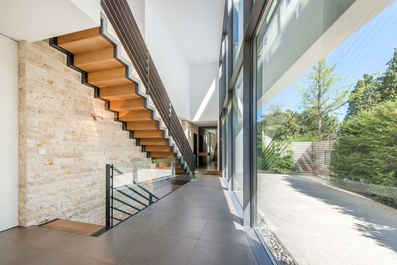 Staircase with natural stone wall