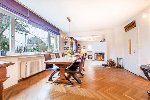 Bright living and dining area with fireplace
