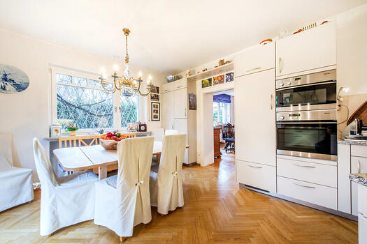 Branded fitted kitchen with original herringbone parquet flooring