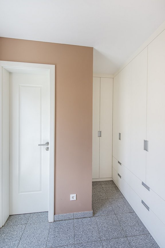 Hallway with fitted wardrobes