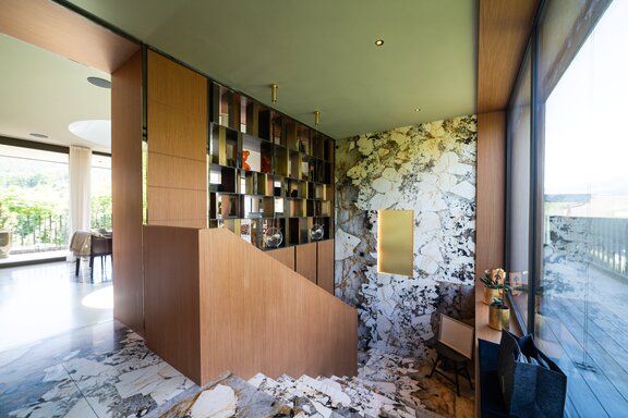 Natural stone and wood connect the living spaces
