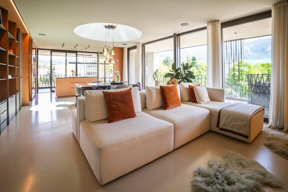 Open-concept living and dining area with access to the patio