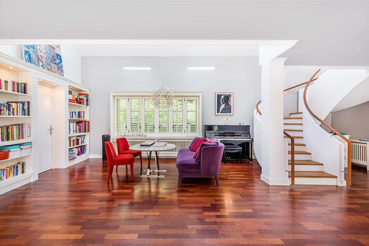 Living room with view of the staircase