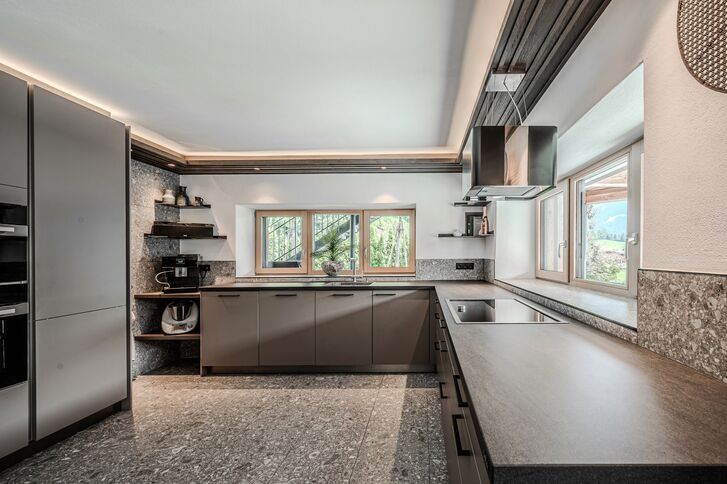 Designer kitchen with high-quality natural stone surfaces