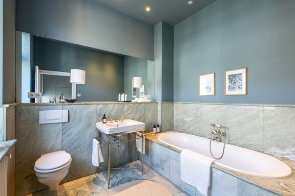 Light marble master bathroom