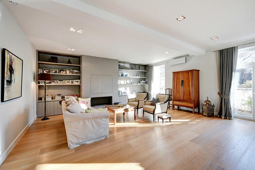 Attractive living area with parquet flooring and fireplace