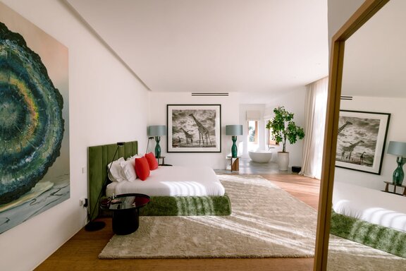 Spacious master suite featuring elegant natural materials