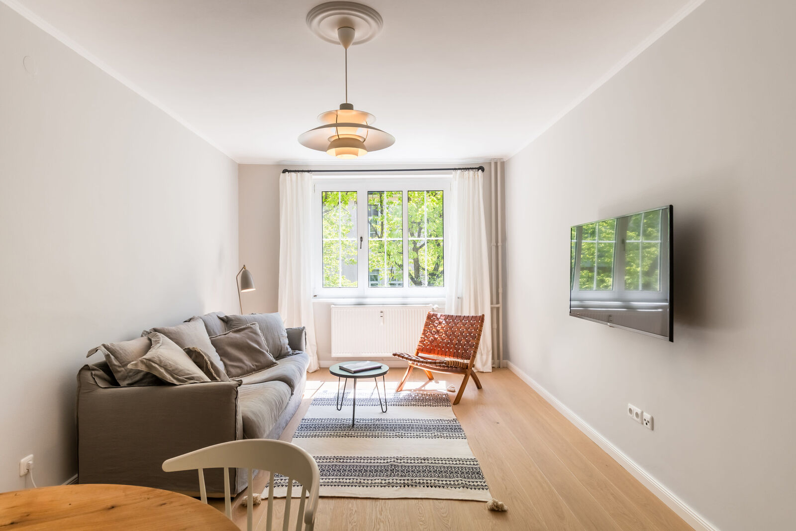 Stylish south-facing living/dining area
