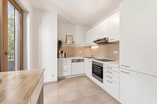Timeless kitchen adjoining the living/dining area