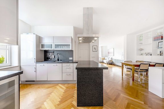 Open kitchen with natural stone cooking counter