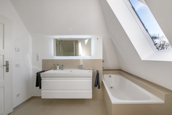 Bright bathroom with shower and bathtub