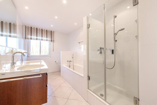 Bright bathroom with shower and tub