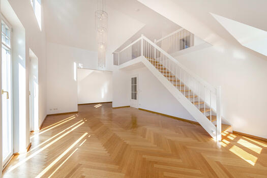 Living/dining area with stairs to the gallery