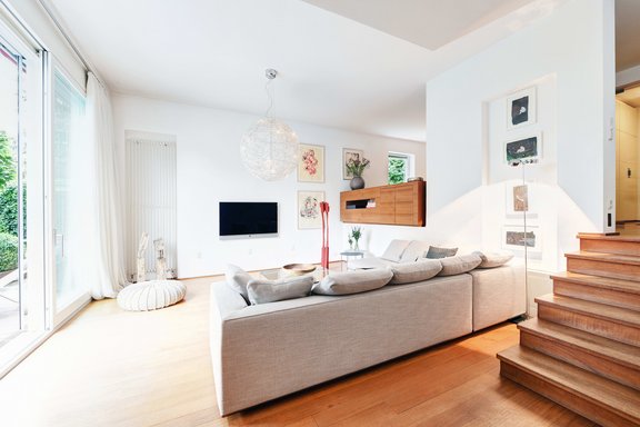Living area with floor to ceiling sliding French doors