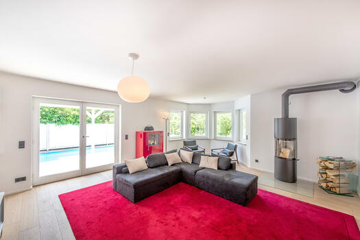 Light-filled living area with wood-burning stove