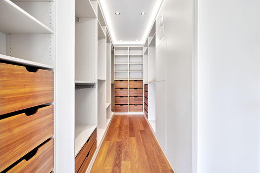 The master dressing room with custom-made fittings between the bedroom and bathroom