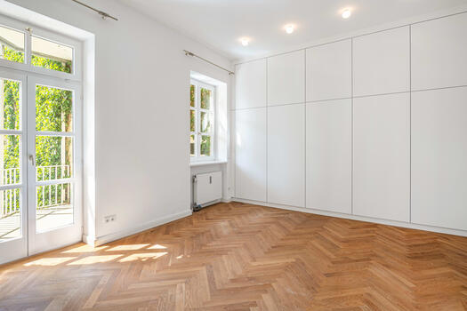 In the bedroom a custom built in wardrobe provides storage space
