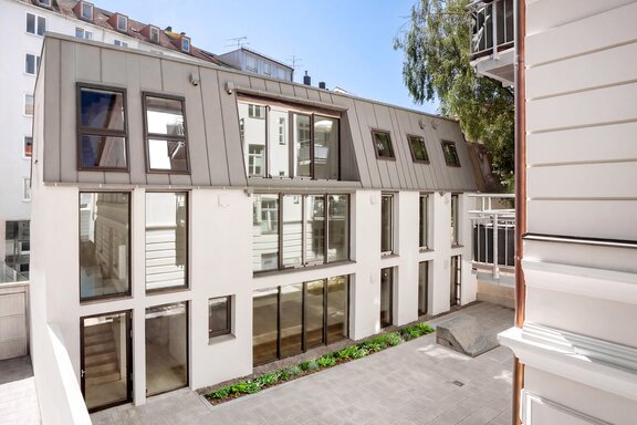 The rear building in its current condition (with a virtual green space in the courtyard)