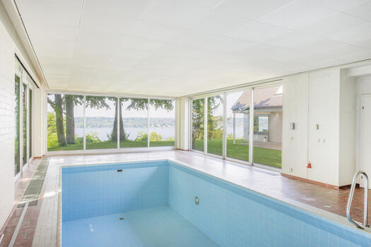 Indoor swimming pool with lake view