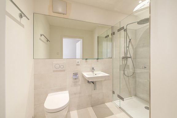 Shower room with elegant fine stone tiles
