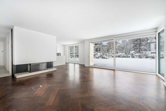 Living area with floor to ceiling windows