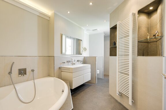 Master bathroom with a shower and a bathtub