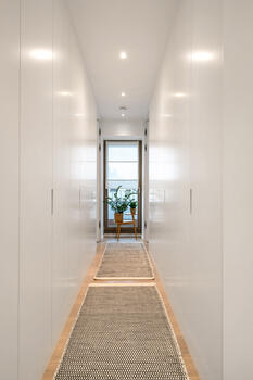 Master dressing room with white custom-made fittings