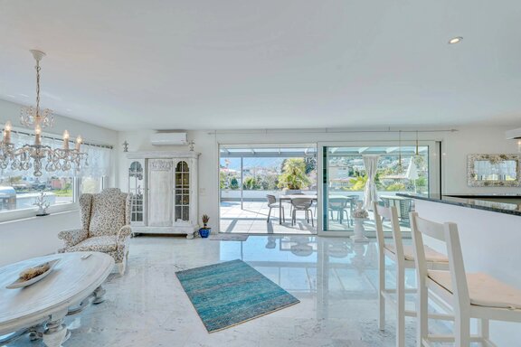 A stylish, open layout between the living area and the patio