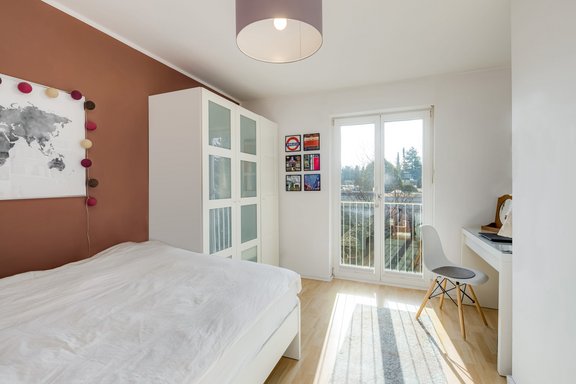 Bright children's room with floor to ceiling windows to the south