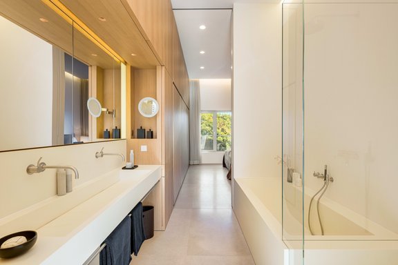 Open master bathroom with doors