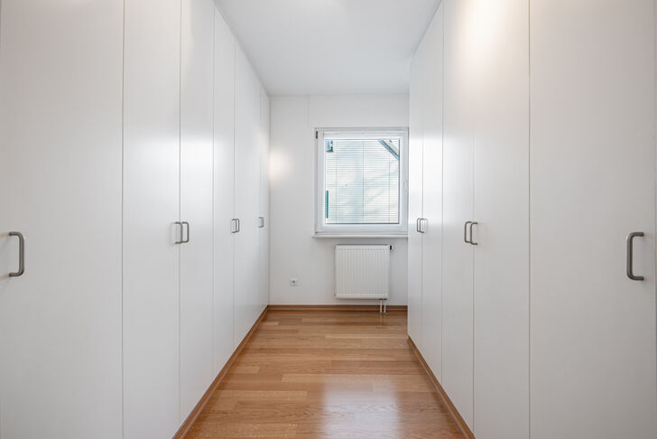 Master closet with custom-built fixtures