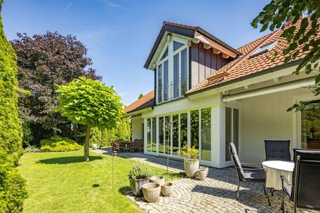Well-maintained single-family home with a cozy atmosphere, a secluded garden oasis, and solar panels
