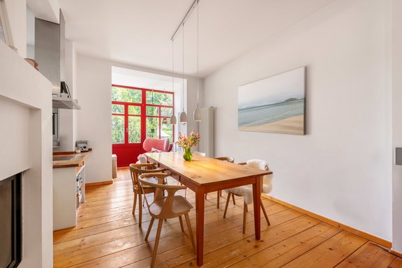 Dining area and open kitchen with fireplace