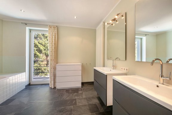 Large children's bathroom with a tub and shower
