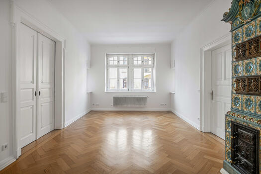 Dining area with historic tiled stove