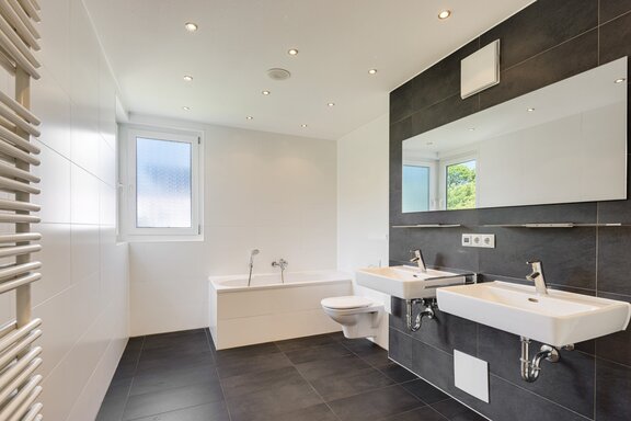 Master bathroom with shower and bathtub