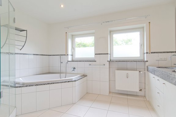 Bathroom with shower and bathtub