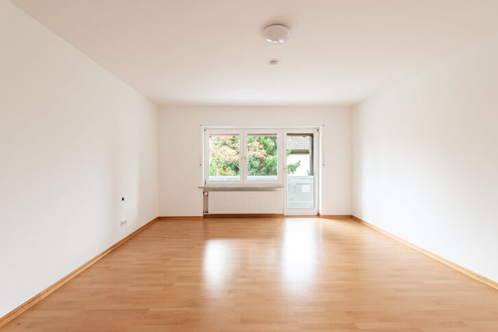 A bright room with access to the balcony
