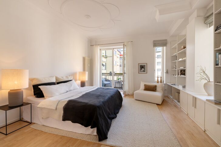 Quiet bedroom with a balcony overlooking the courtyard