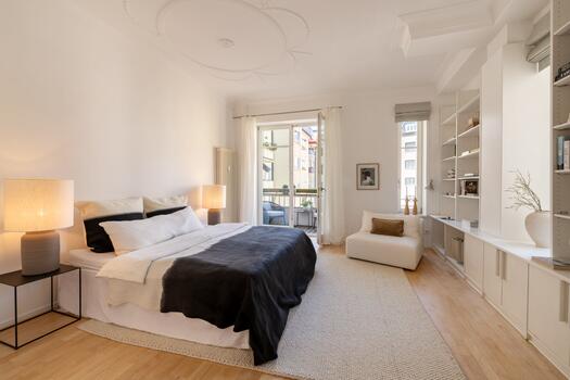 Quiet bedroom with a balcony overlooking the courtyard