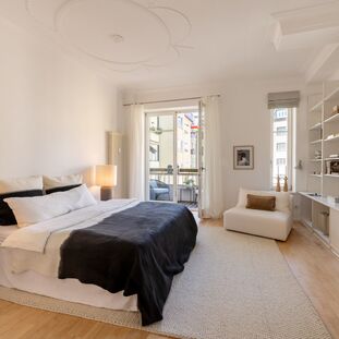 Quiet bedroom with a balcony overlooking the courtyard