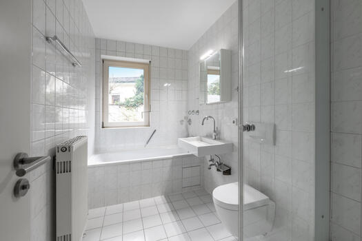 Bathroom with tub and shower