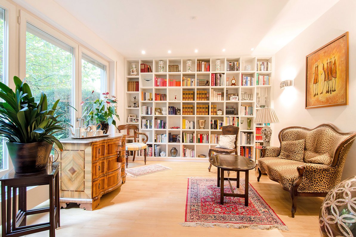 Light filled living room with library